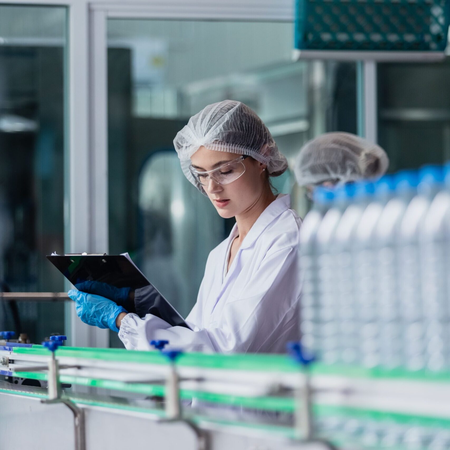 Women working in a plastic bottle factory